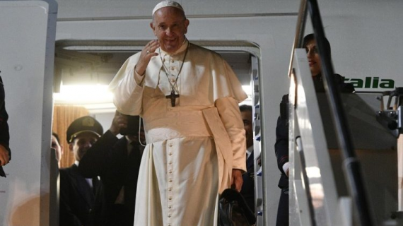 Pope Francis waves as he boards the papal plane (Vatican Media)